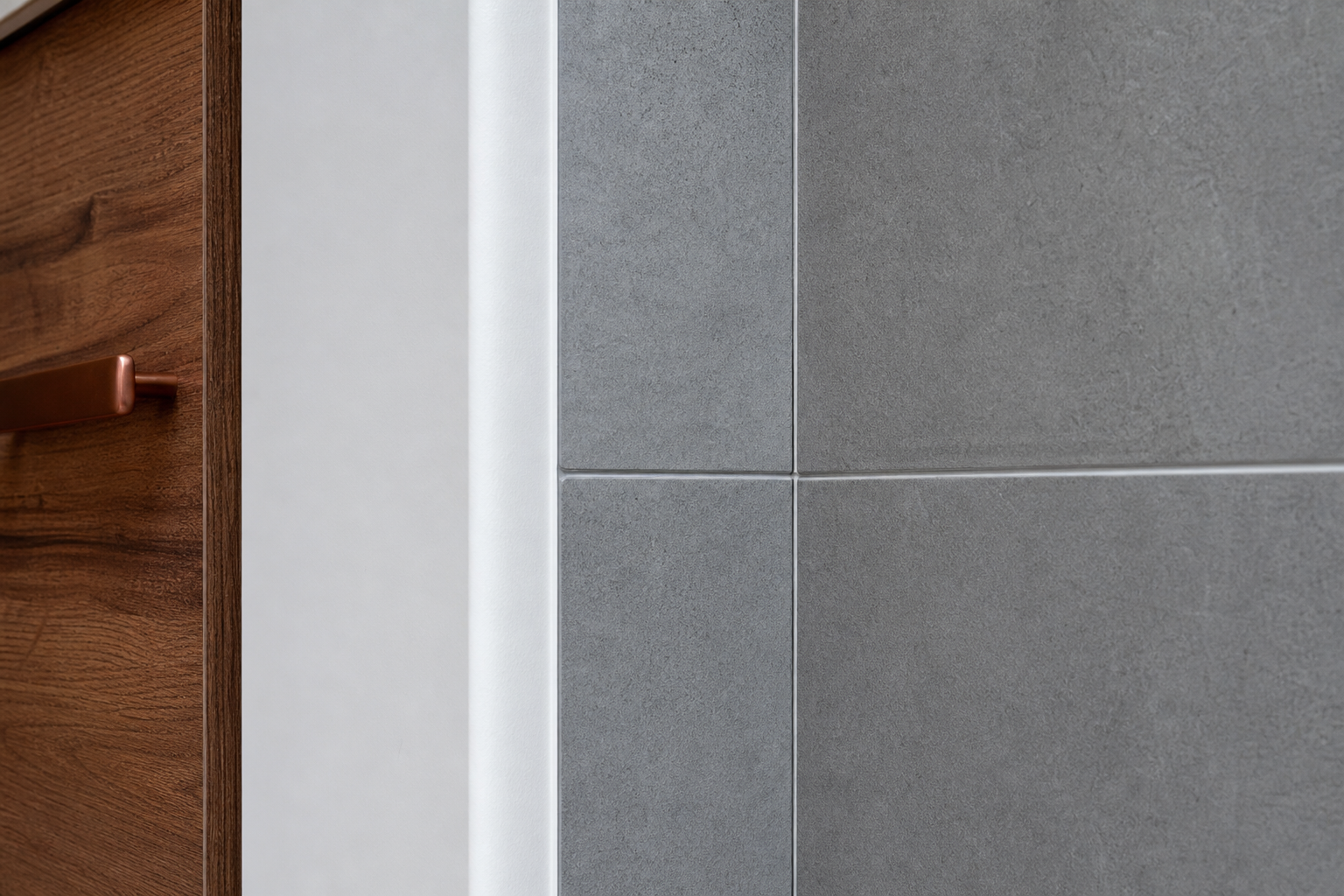 Close-up of finish carpentry and tile work showing tight joints and even reveals in a Calgary renovation