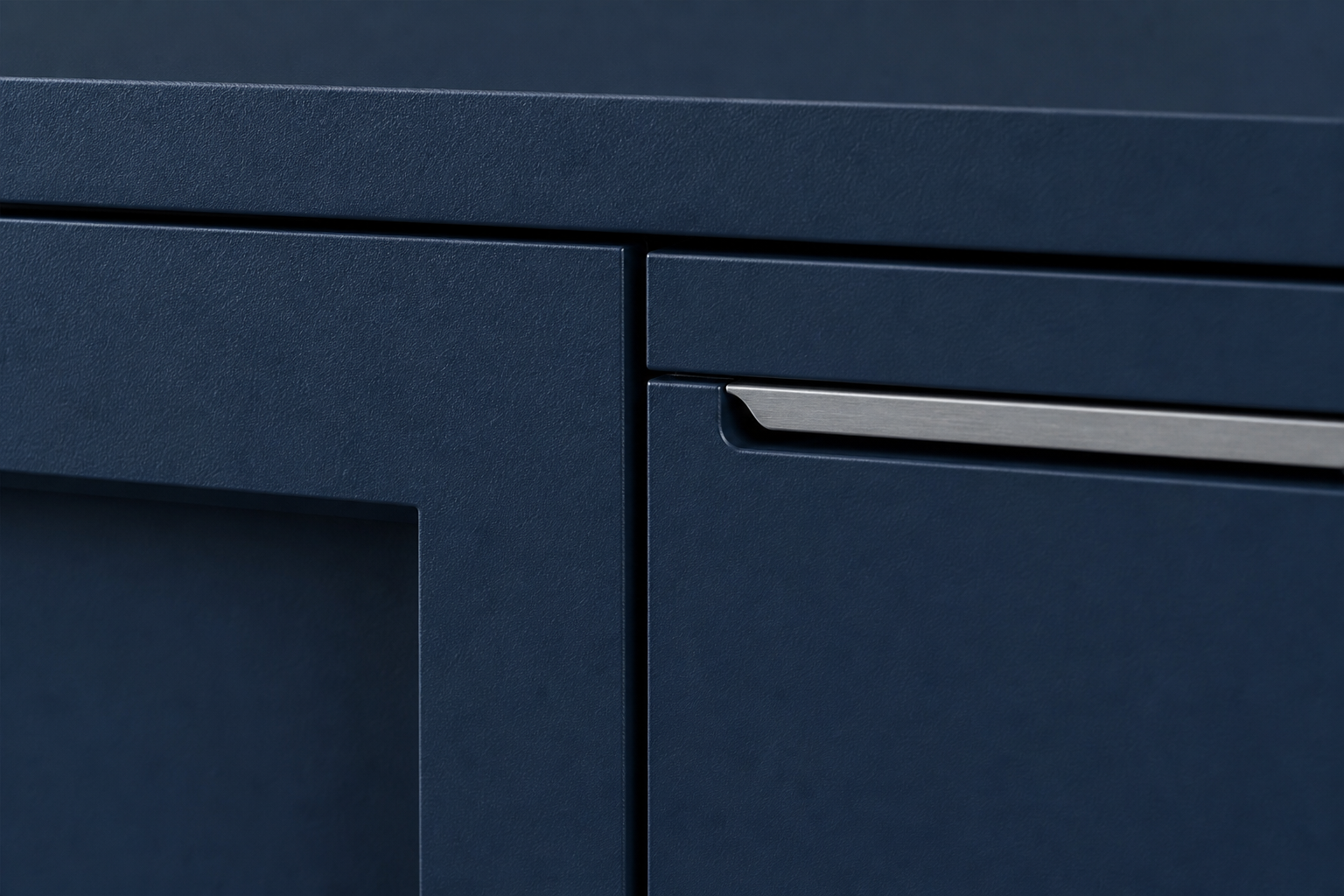 Close-up of a custom cabinet door reveal and integrated handle showing an even gap and aligned grain