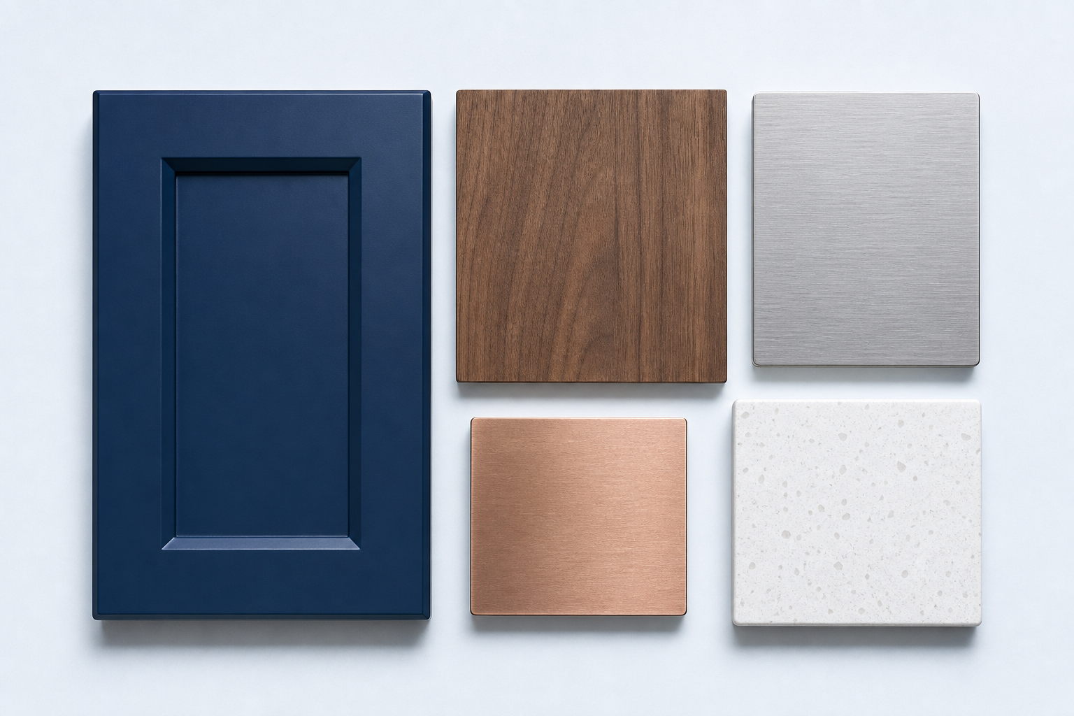 Cabinet finish samples in navy, warm wood and brushed steel laid out for a Calgary custom cabinetry plan